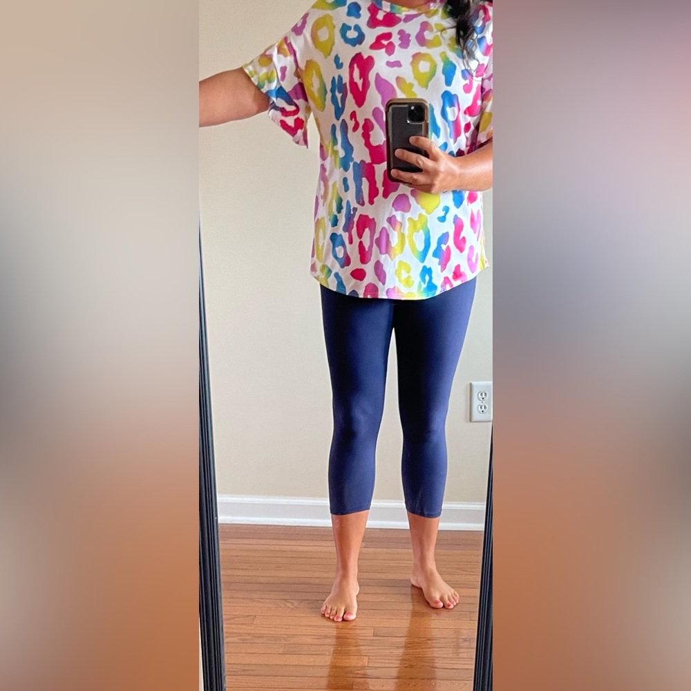 Heimish U.S.A women’s size S multi-colored leopard print with flowy sleeves.